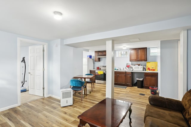 3532 Longfellow Ave, Minneapolis, MN 55407 - living room with light wood-style flooring and baseboards