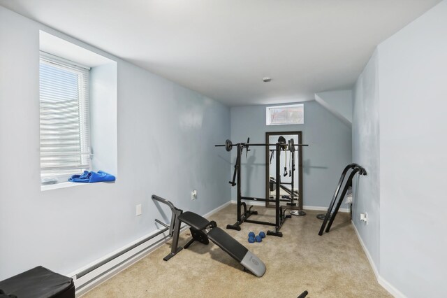 3532 Longfellow Ave, Minneapolis, MN 55407 - exercise room with a baseboard radiator, carpet flooring, and baseboards