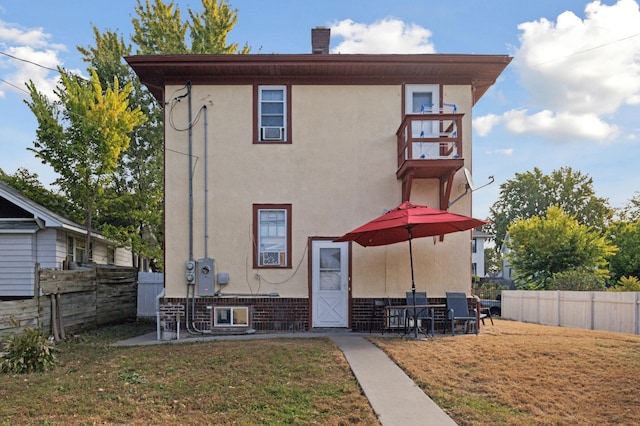 3532 Longfellow Ave, Minneapolis, MN 55407 - back of property featuring a balcony and stucco siding