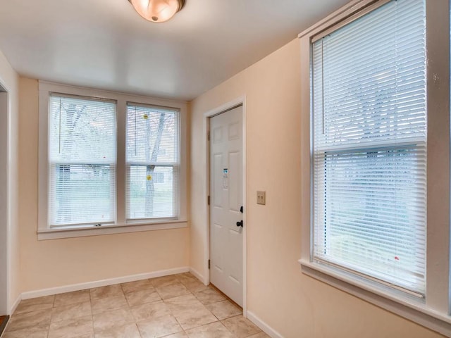 entrance foyer with light tile patterned flooring