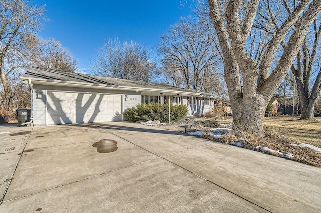 ranch-style house featuring a garage