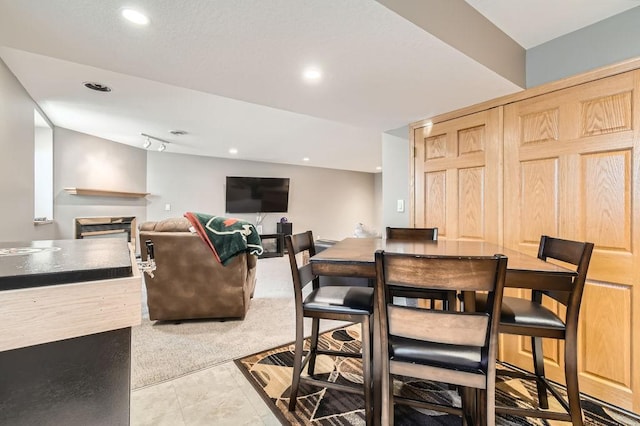 dining area with light carpet