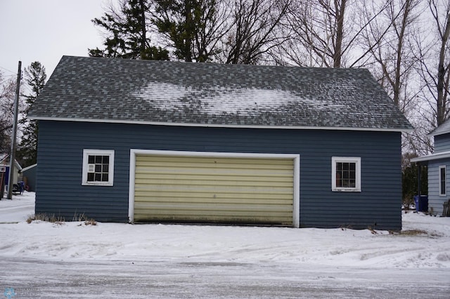 view of snow covered garage