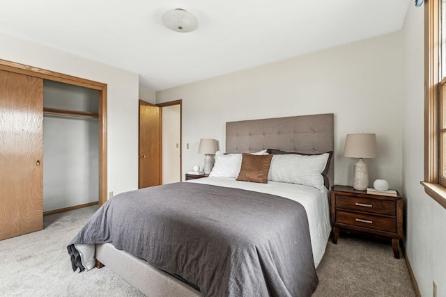 bedroom with light colored carpet and a closet