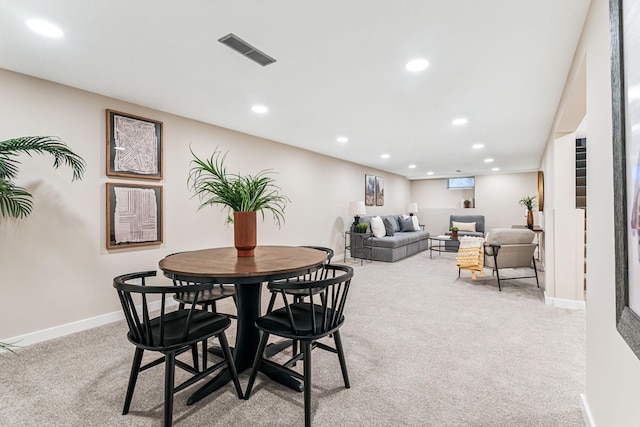 view of carpeted dining space