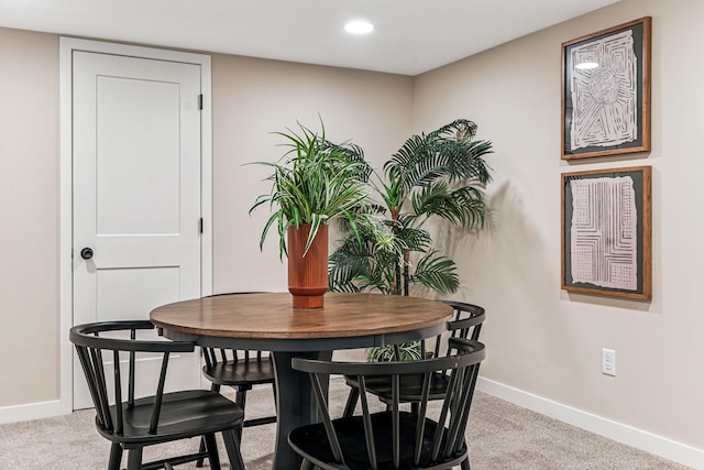 dining area with light carpet