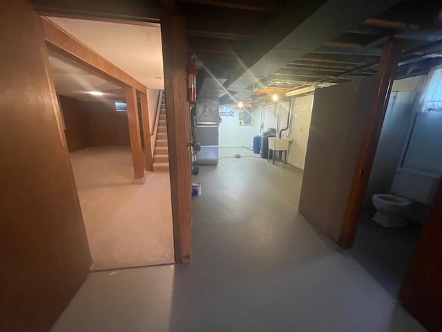 basement with washer / clothes dryer and sink