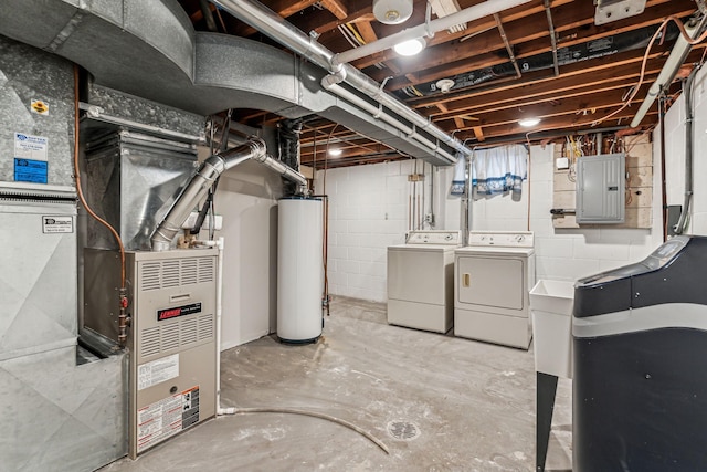 basement with washer and clothes dryer, gas water heater, and electric panel