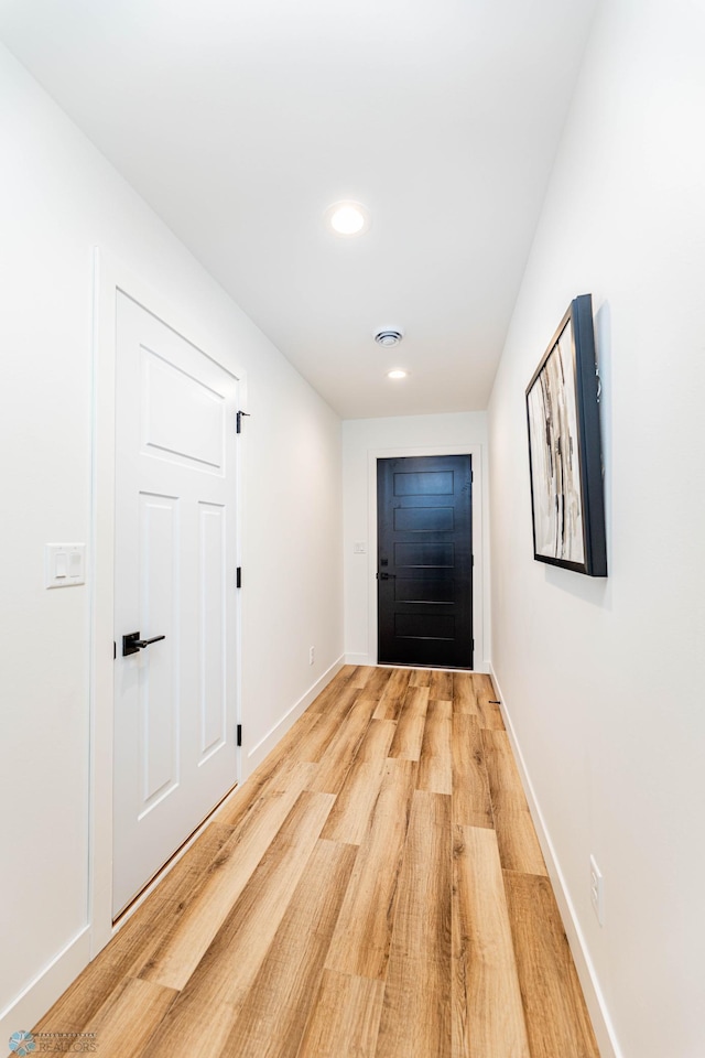 entryway with hardwood / wood-style floors