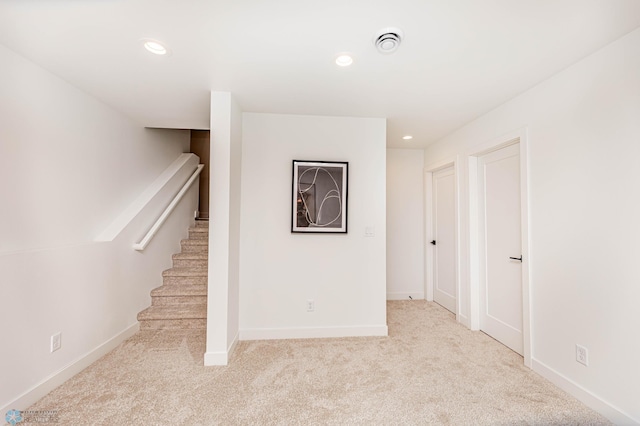 interior space featuring light colored carpet