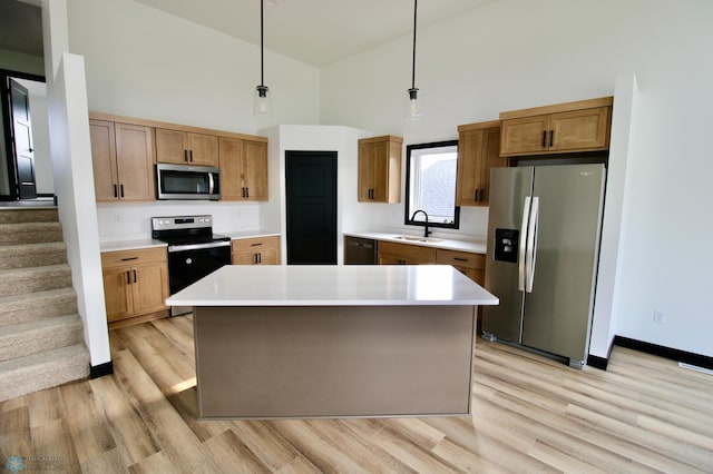 6721 67th Ave S, Horace, ND 58047 - kitchen with stainless steel appliances, high vaulted ceiling, a sink, light wood-style flooring, and light countertops