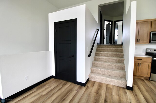 6721 67th Ave S, Horace, ND 58047 - stairs with wood finished floors and baseboards