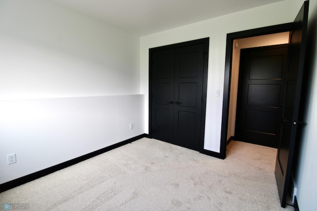 6721 67th Ave S, Horace, ND 58047 - unfurnished bedroom with light carpet, baseboards, and a closet