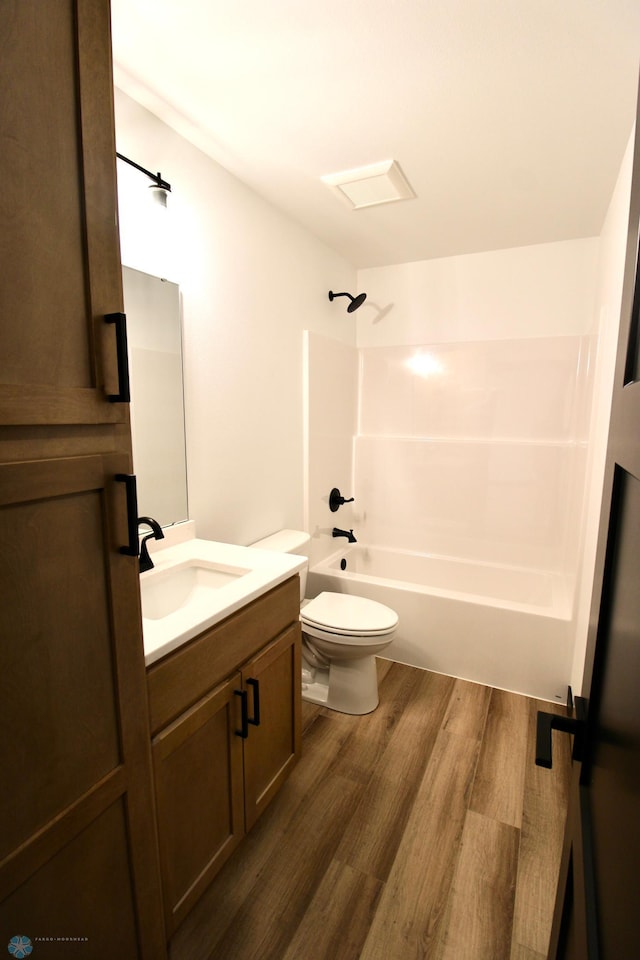 6721 67th Ave S, Horace, ND 58047 - bathroom with wood finished floors, vanity, toilet, and bathing tub / shower combination