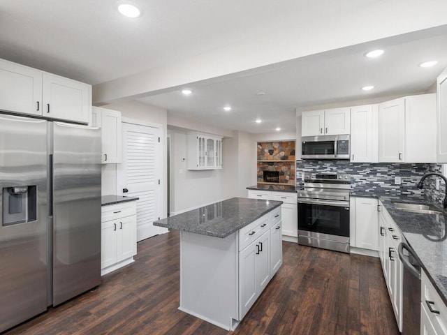 kitchen featuring white cabinetry, dark hardwood / wood-style flooring, and stainless steel appliances