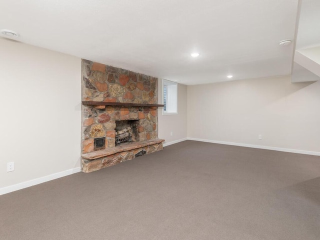 unfurnished living room with a fireplace and carpet floors