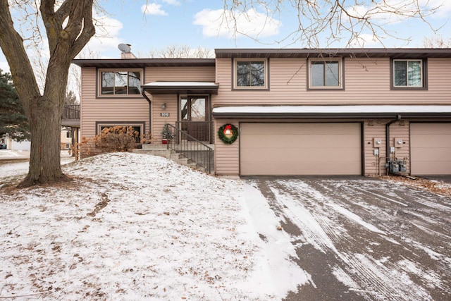 bi-level home featuring a garage