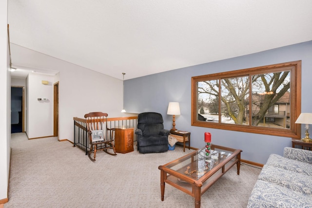 living room with lofted ceiling and light carpet