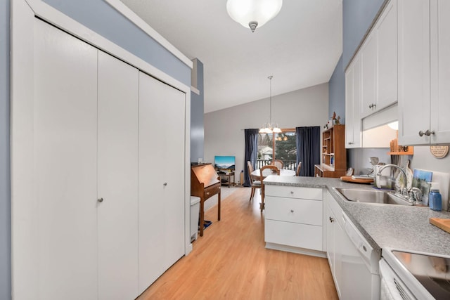 kitchen with vaulted ceiling, decorative light fixtures, light hardwood / wood-style flooring, dishwasher, and white cabinets