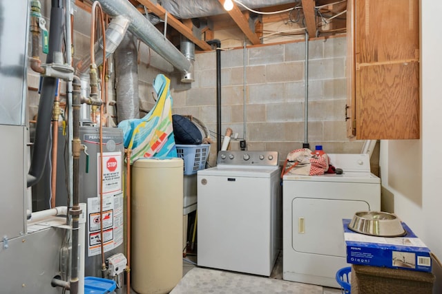 washroom featuring washer and clothes dryer and gas water heater