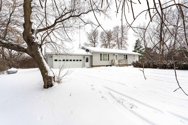 view of front of property with a wooden deck and a garage