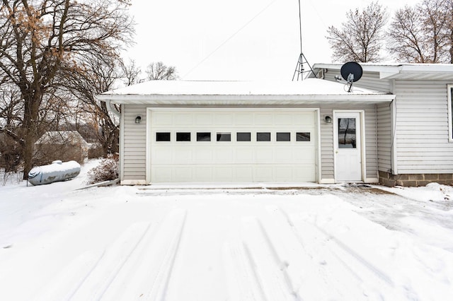 view of snow covered garage