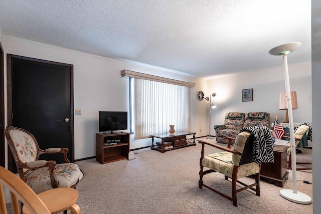 carpeted living room featuring a textured ceiling