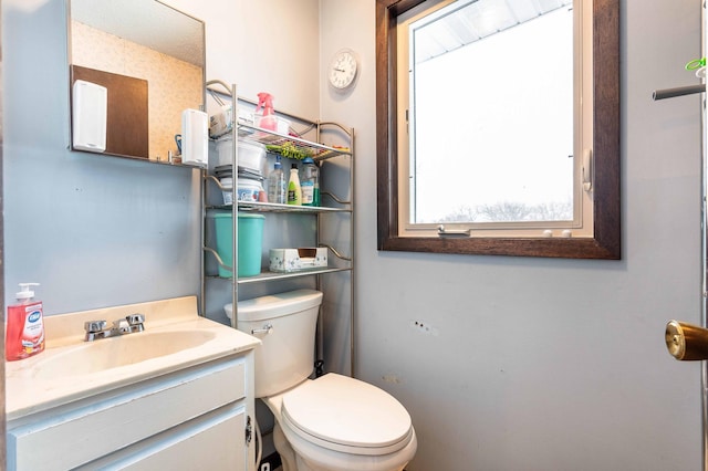 bathroom with vanity and toilet