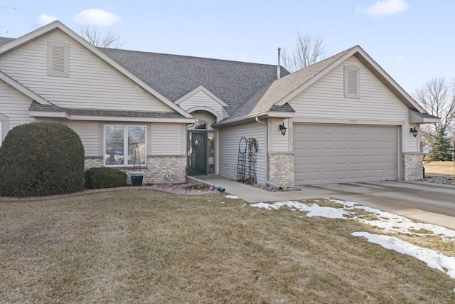 view of front of home with a garage and a front yard