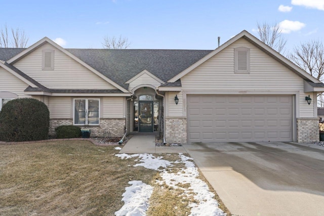 view of front of home with a garage and a front yard