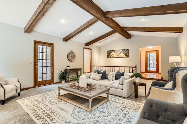 living room with lofted ceiling with beams and light colored carpet