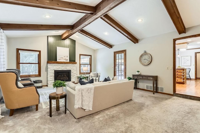 living room with light colored carpet, a fireplace, and lofted ceiling with beams