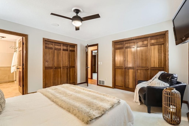 carpeted bedroom featuring ceiling fan and connected bathroom