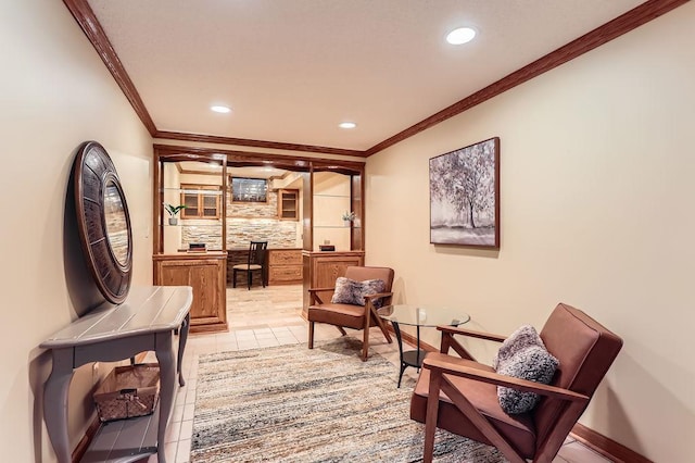 living area featuring crown molding and light tile patterned floors