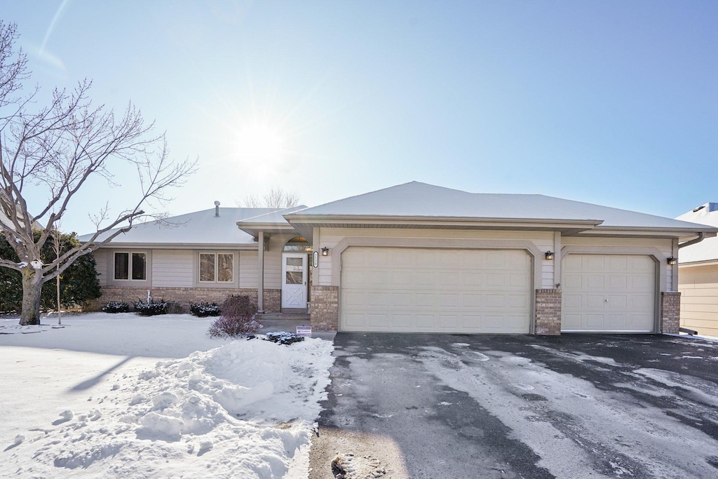 ranch-style home featuring a garage