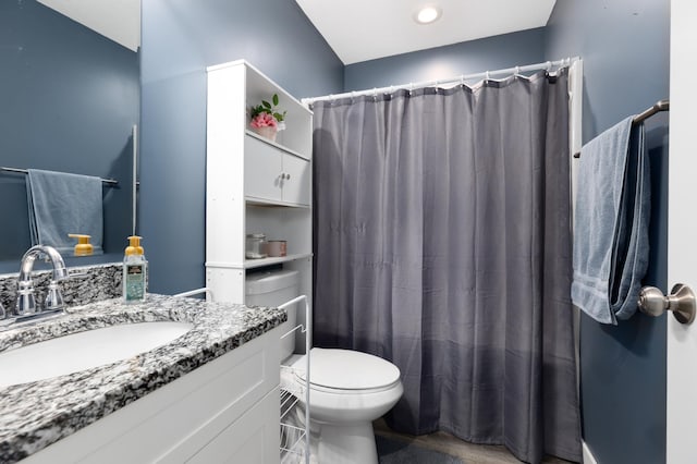 full bathroom featuring vanity, toilet, and shower / tub combo with curtain