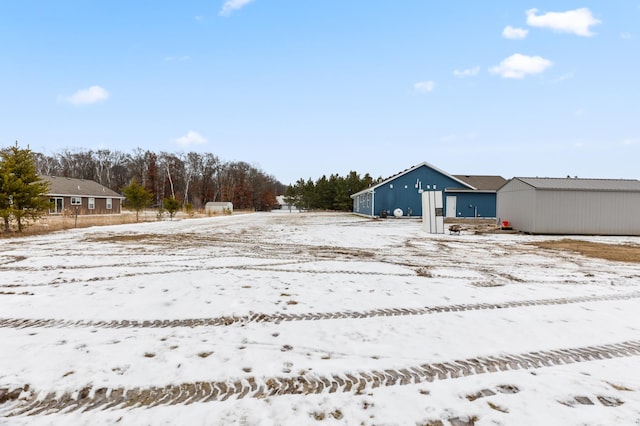 view of yard covered in snow