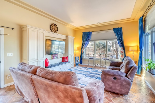 living room with ornamental molding and plenty of natural light