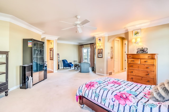 bedroom featuring ceiling fan, light colored carpet, and ornamental molding