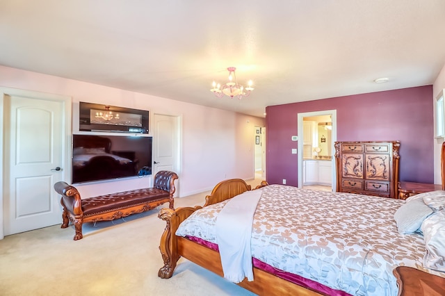 carpeted bedroom with ensuite bath and an inviting chandelier