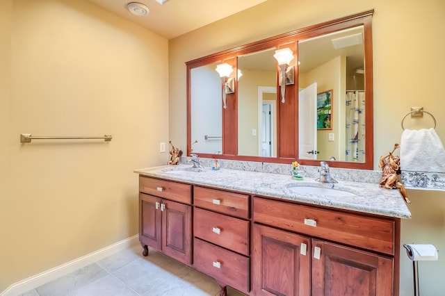 bathroom featuring tile patterned floors and vanity