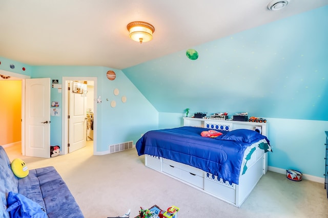 bedroom featuring vaulted ceiling and carpet flooring