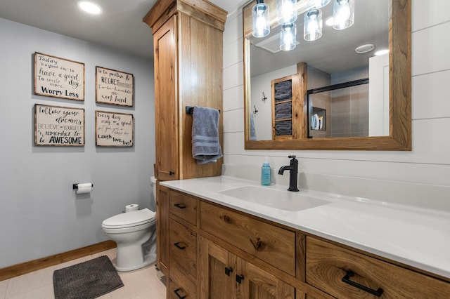 bathroom with vanity, walk in shower, tile patterned floors, and toilet