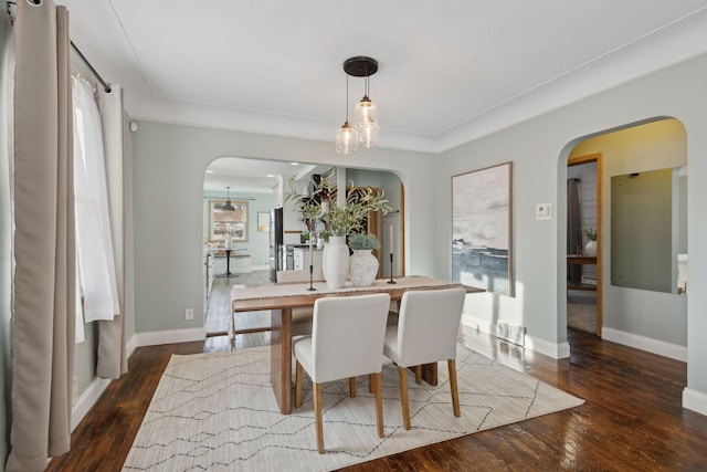 dining area featuring dark hardwood / wood-style flooring