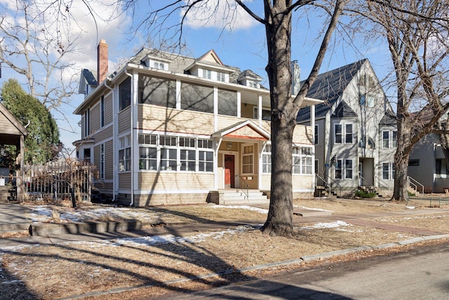 view of front of property with a sunroom