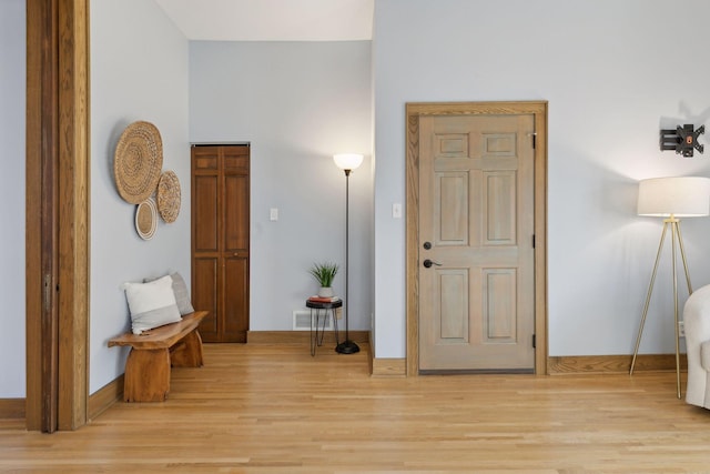 entryway with light hardwood / wood-style floors