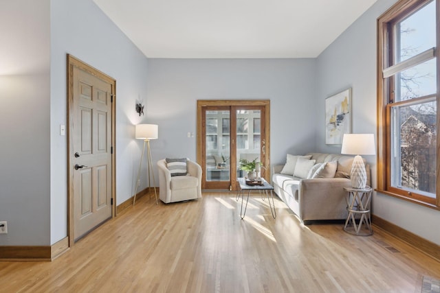 sitting room featuring light hardwood / wood-style flooring