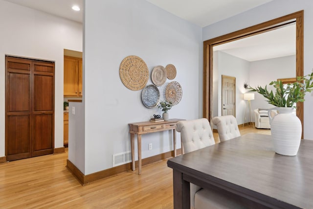 dining area with light wood-type flooring