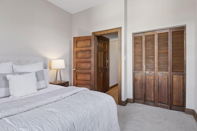 carpeted bedroom with a closet