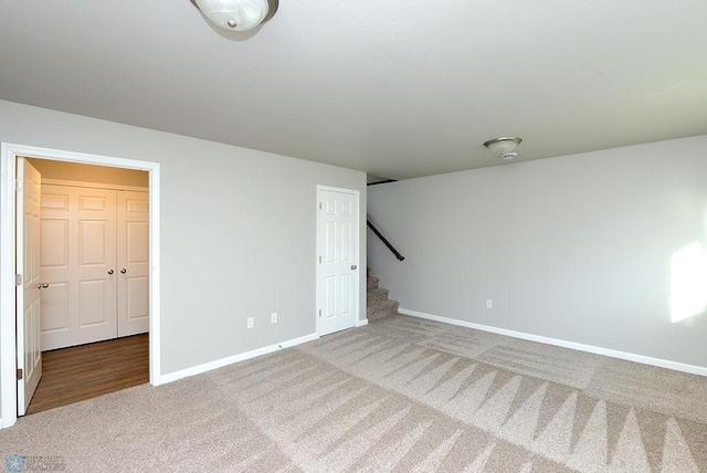 unfurnished bedroom with a closet and carpet floors